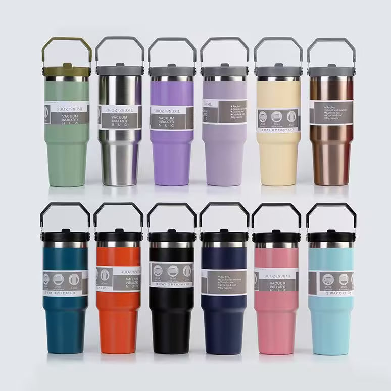 Set of colorful insulated travel mugs with labels on a white background