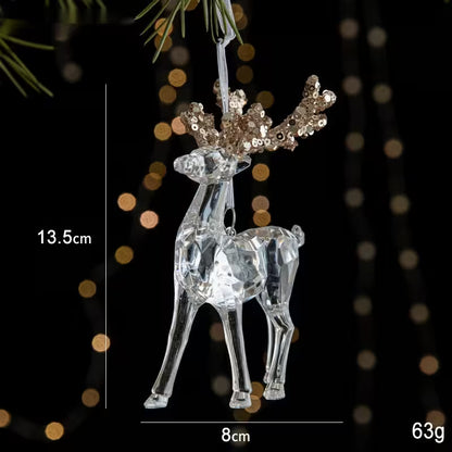 Clear reindeer ornament with gold antlers on a dark background with bokeh lights