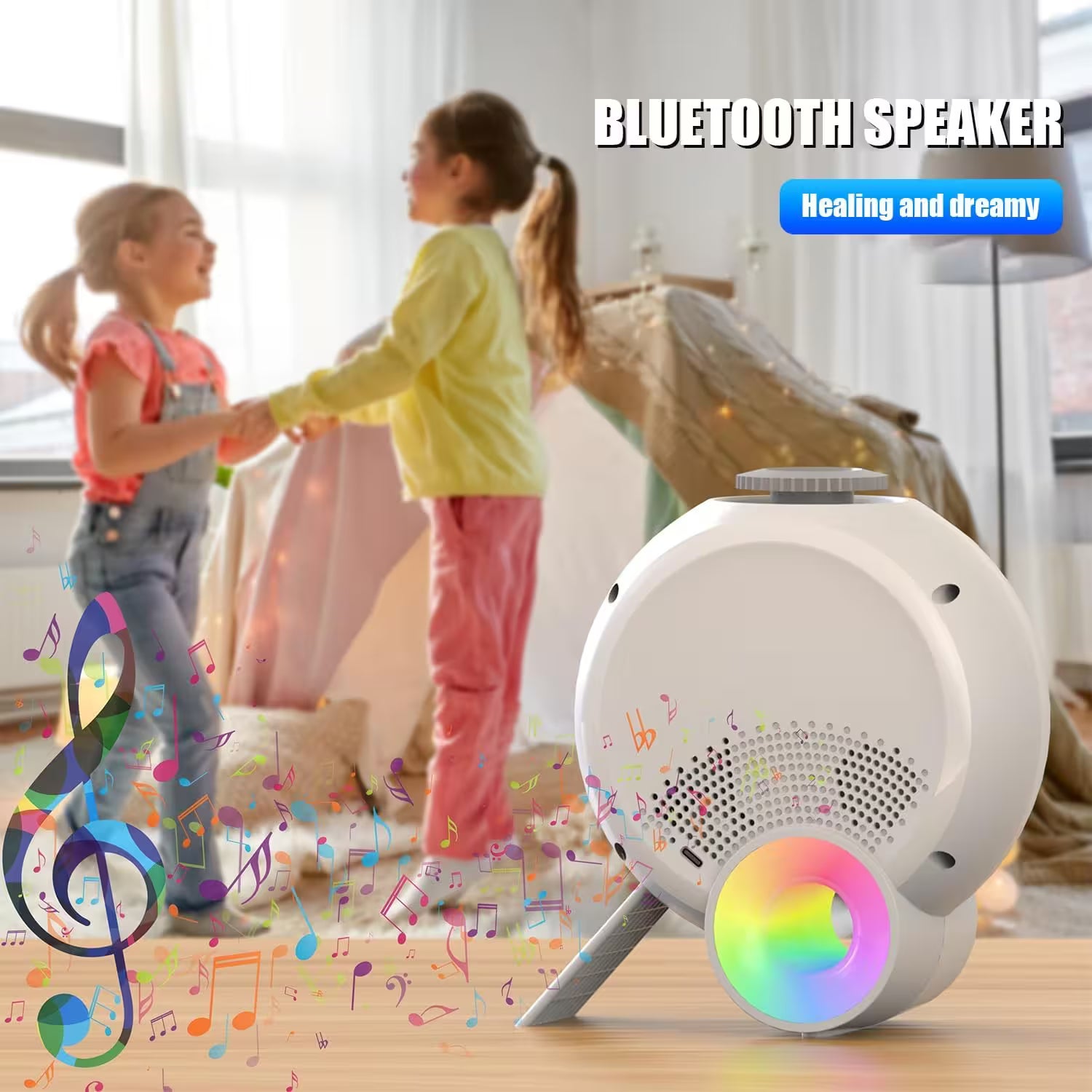 White Bluetooth speaker with colorful design on a wooden surface, children playing in the background.