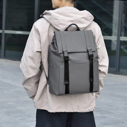 Person wearing a gray backpack outdoors