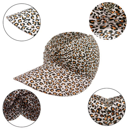 Leopard print visor hat with close-up details on a white background