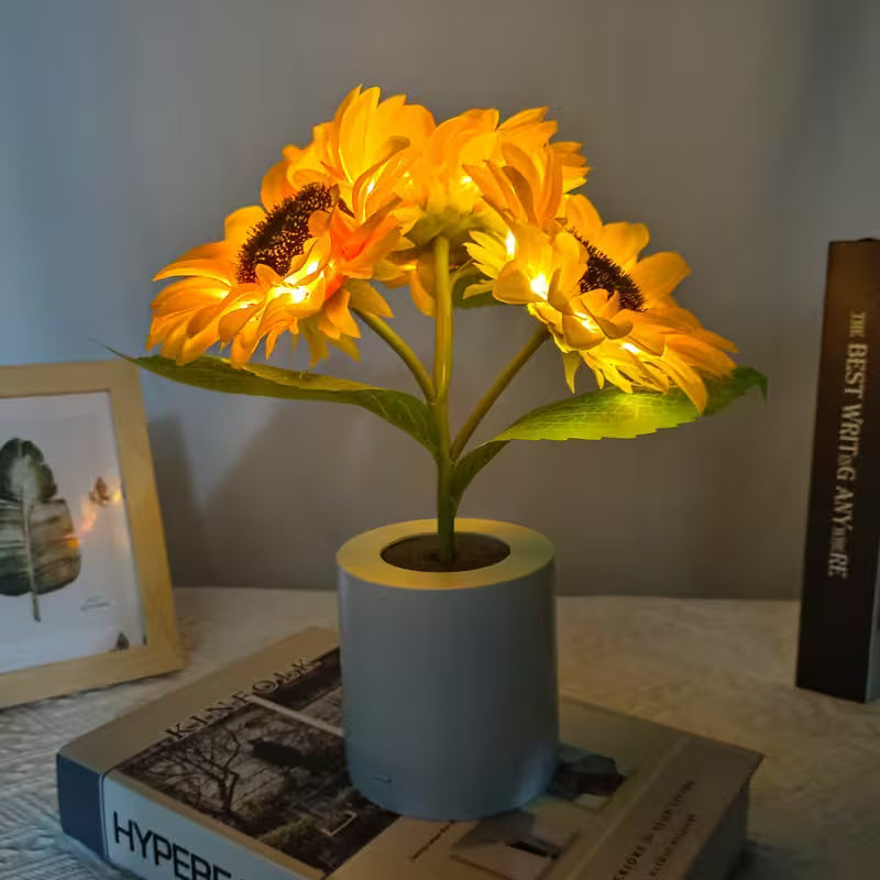 Decorative lamp with sunflower design on a surface