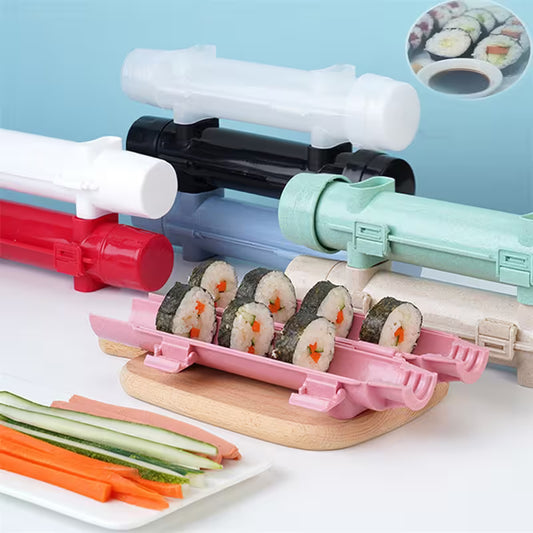 Sushi-making kit with colorful rollers and pre-made sushi on a white surface.