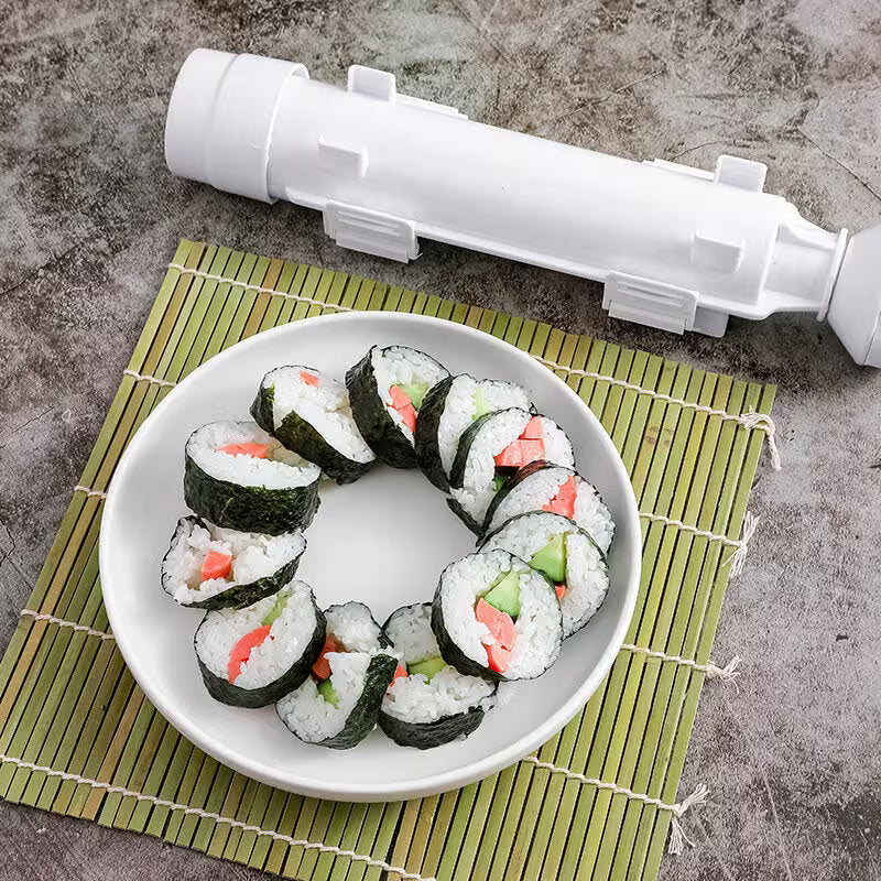 Sushi rolls on a plate with a white cylindrical object on a textured surface
