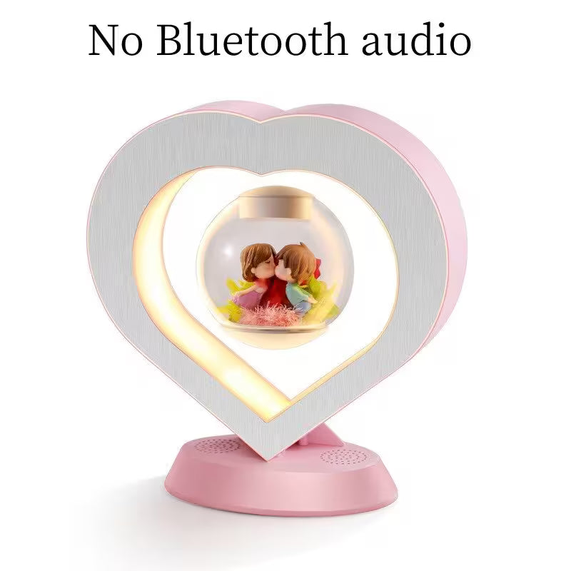 Heart-shaped lamp with Bluetooth speaker on a white background