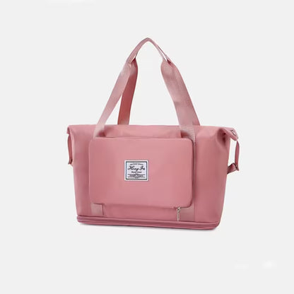 Pink tote bag with a visible brand label on a white background