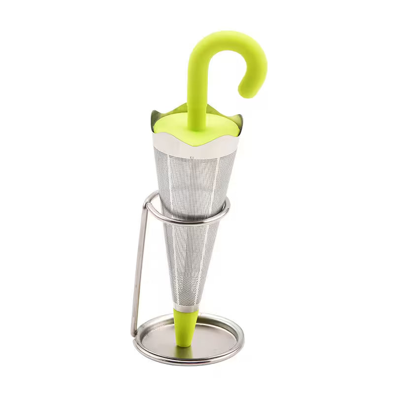 Tea infuser with green handle and stand on a white background