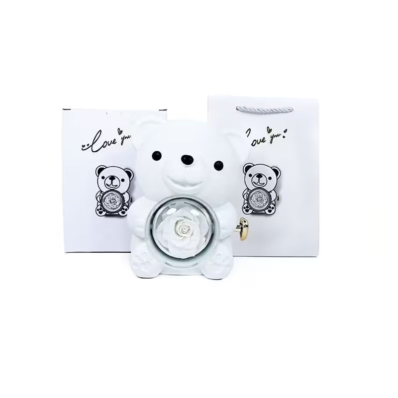 White teddy bear-shaped night light with a rose inside, placed on a white background.
