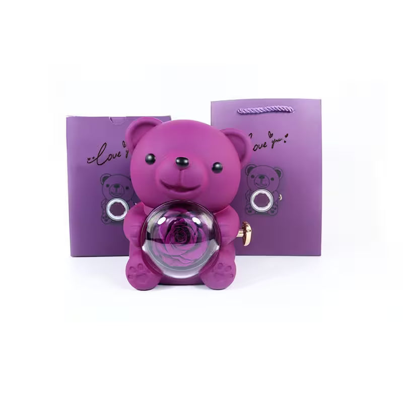 Purple teddy bear-shaped container with a rose inside, set against a white background