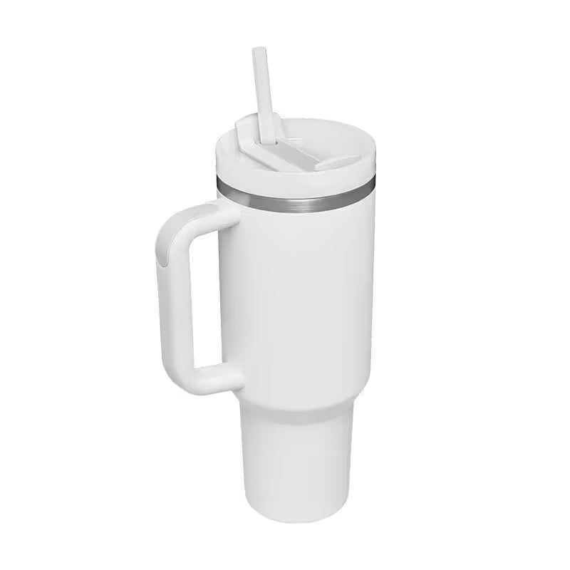 White tumbler with a handle and straw on a white background