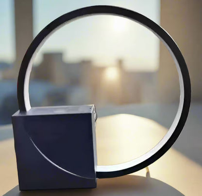 Modern table lamp with circular design on a blurred background