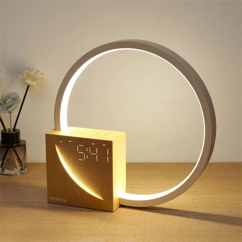 Modern clock with circular light feature on a wooden surface