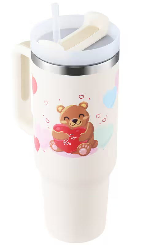 White mug with a bear design holding a heart, on a white background