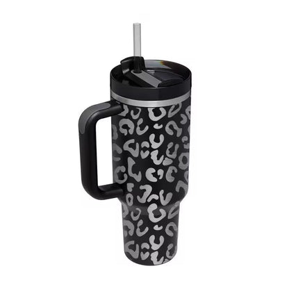 Black tumbler with white pattern on a white background