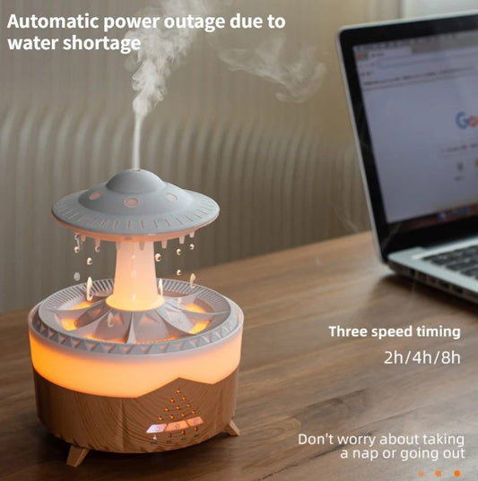 UFO-shaped humidifier on a desk with a laptop in the background