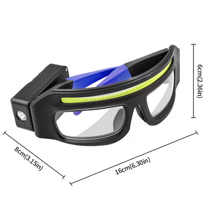 Black safety goggles with blue interior and clear lenses, shown with measurements on a white background.
