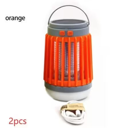 Orange camping lantern with gray base and handle on a white background