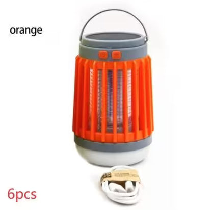 Orange camping lantern with gray base and handle on a white background