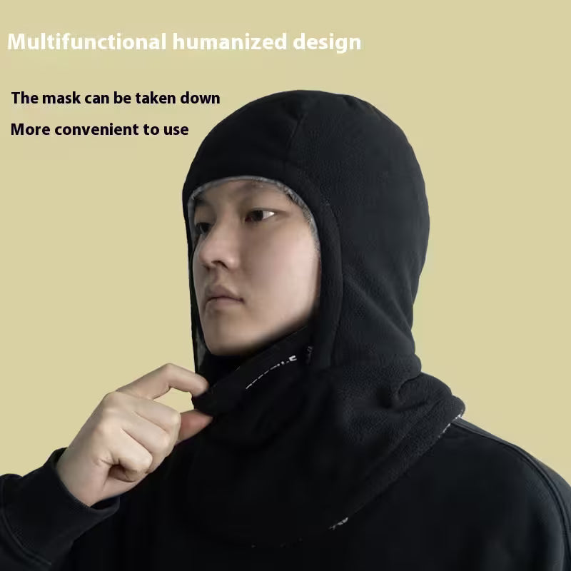 Person wearing a black multifunctional hood with text on a beige background