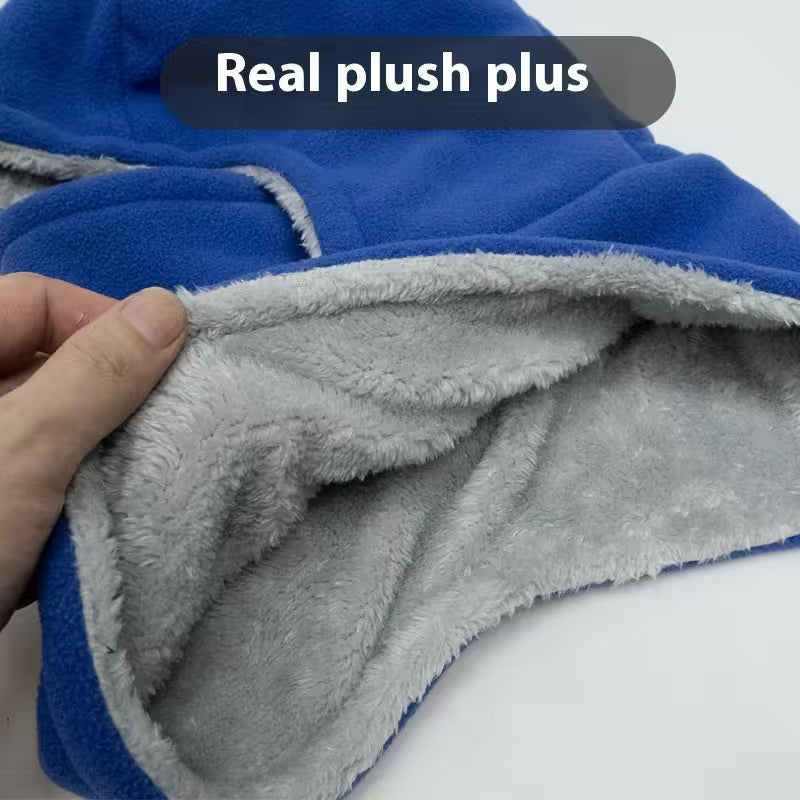 Close-up of blue and gray fabric with a hand touching the gray side, labeled 'Real plush plus'.