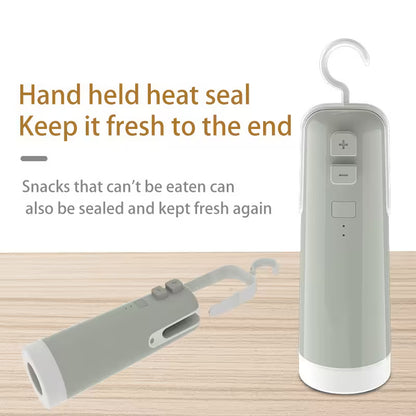 Handheld heat seal device with a hook on a wooden surface, featuring text about keeping snacks fresh.