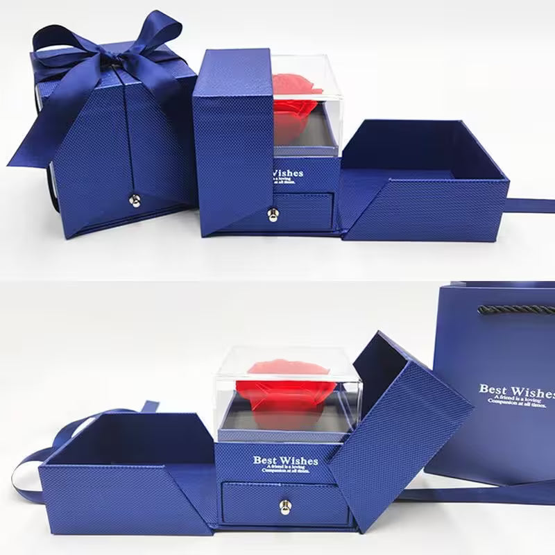 Blue gift box with a clear lid displaying a red item, on a white background.