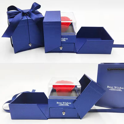 Blue gift box with a clear lid displaying a red item, on a white background.