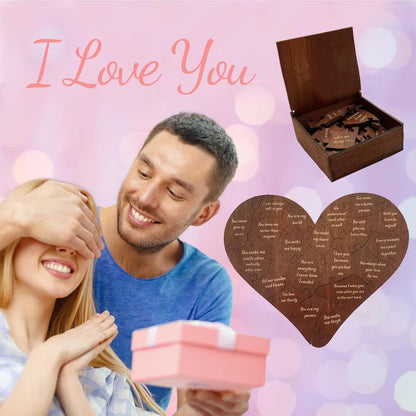 Couple with a pink gift box and wooden heart-shaped plaque on a pink background with 'I Love You' text.