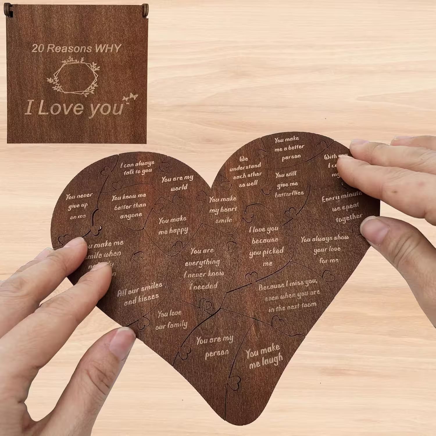 Heart-shaped wooden puzzle with engraved text on a wooden surface