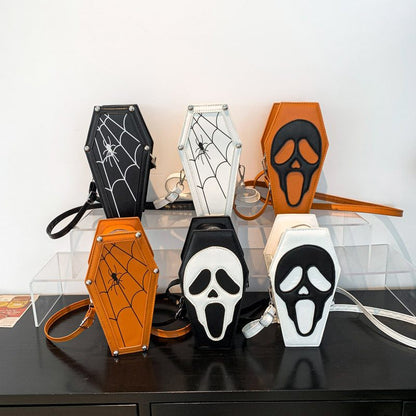 Halloween-themed pouches with coffin design on a clear stand.