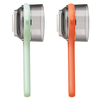 Two earbud headphones, one green and one orange, on a white background