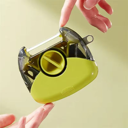 Yellow tape dispenser held by a hand against a light yellow background