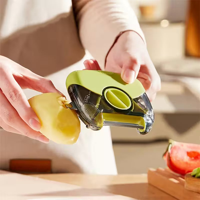 Person using a green apple peeler to remove skin from an apple in a kitchen setting.