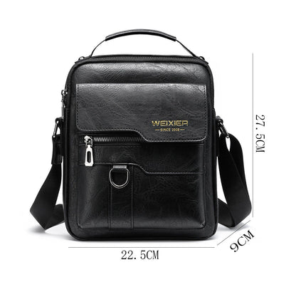 Black leather crossbody bag with measurements on a white background