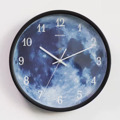 Wall clock with moon design on a white background