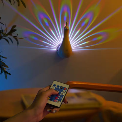 Colorful light show projected by a duck-shaped device with a hand holding a remote control.