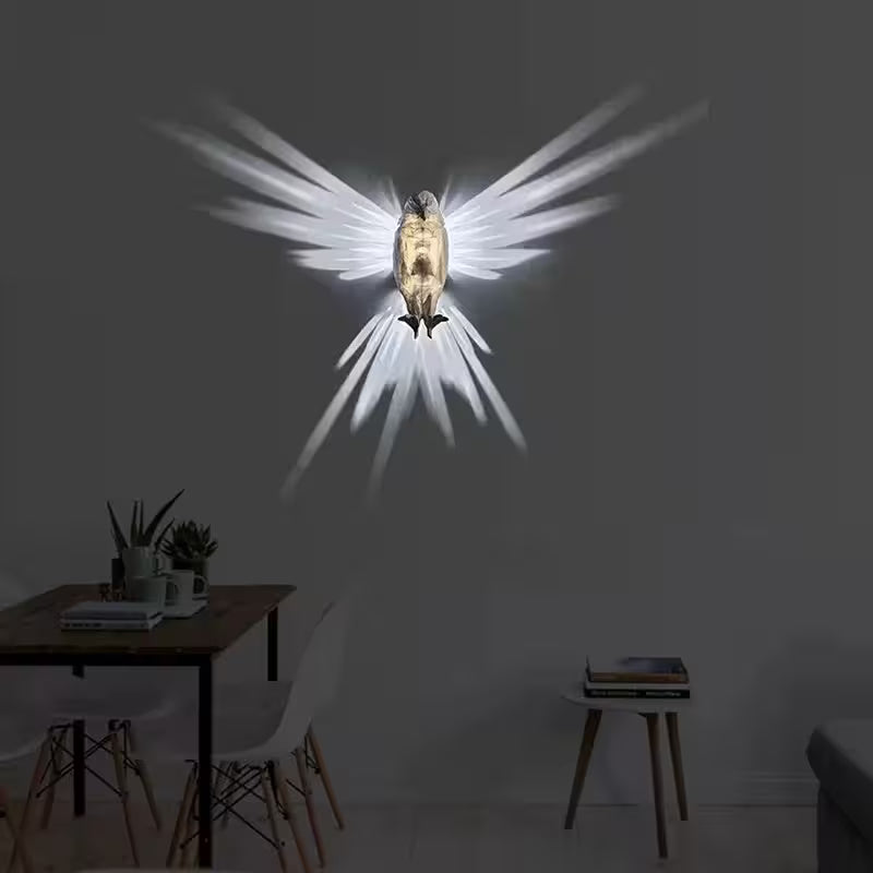 Light fixture shaped like a bird with spread wings on a dark wall above a dining table.