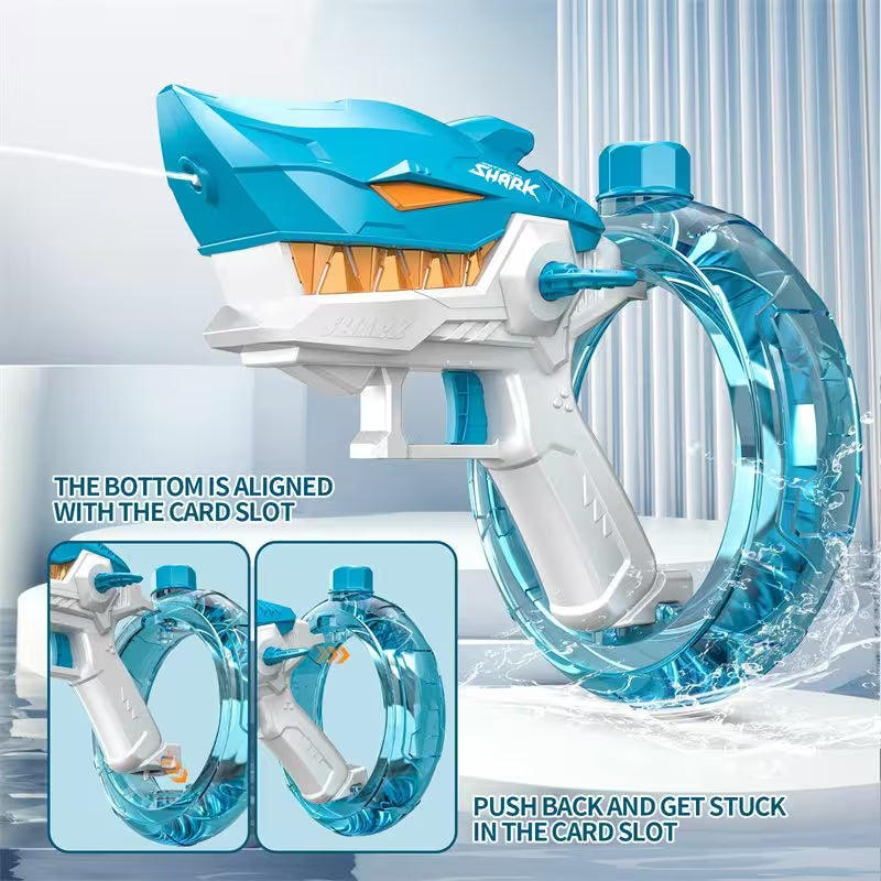 Shark-themed water blaster toy with clear blue and white design, featuring text instructions.
