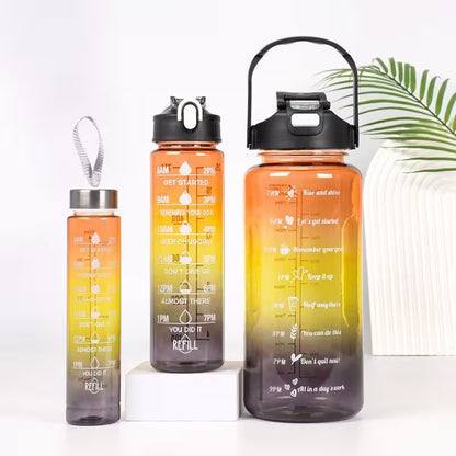 Set of four gradient water bottles with motivational text on a white background