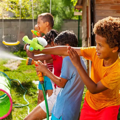 Children playing with a water gun in a backyard