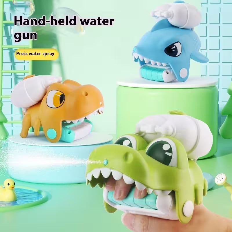 Hand-held water gun toys shaped like a shark, dinosaur, and crocodile on a green background.