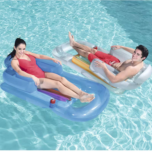 Two people lounging on inflatable pool floats in a pool.