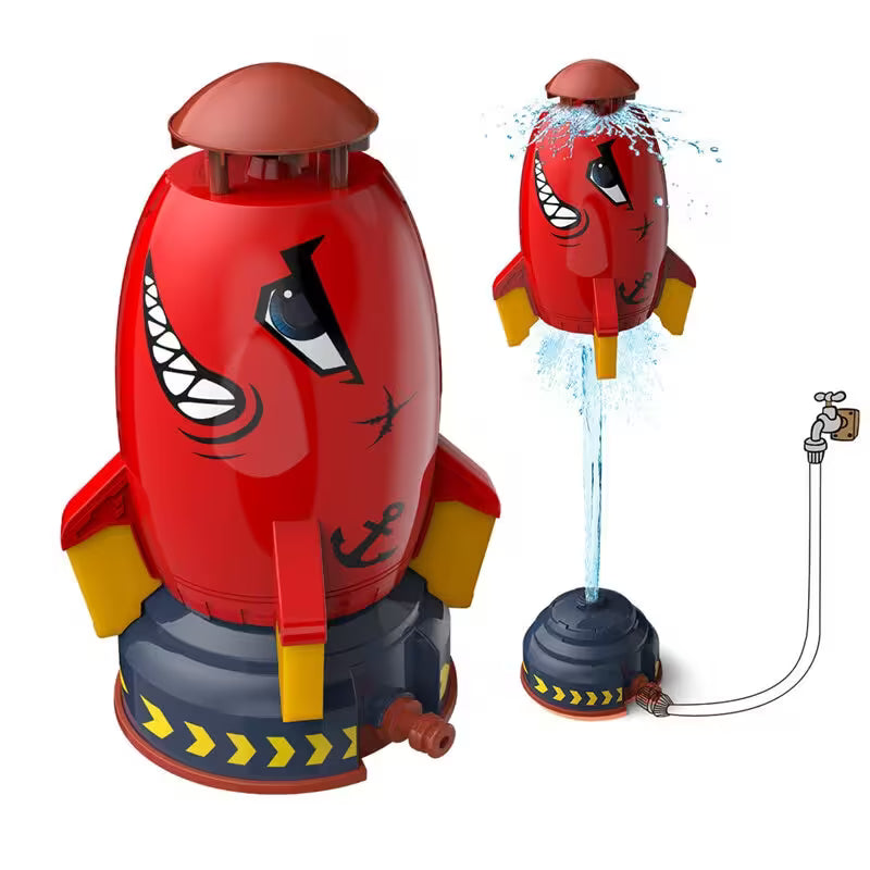 Red toy rocket with a face design, attached to a water sprayer on a white background