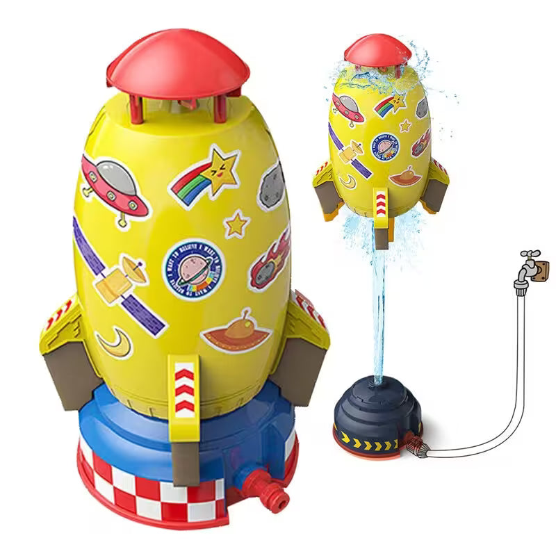 Colorful toy rocket with water sprayer on a white background