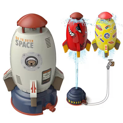Toy rocket ship with 'Go to Outer Space' text and water squirting feature on a white background