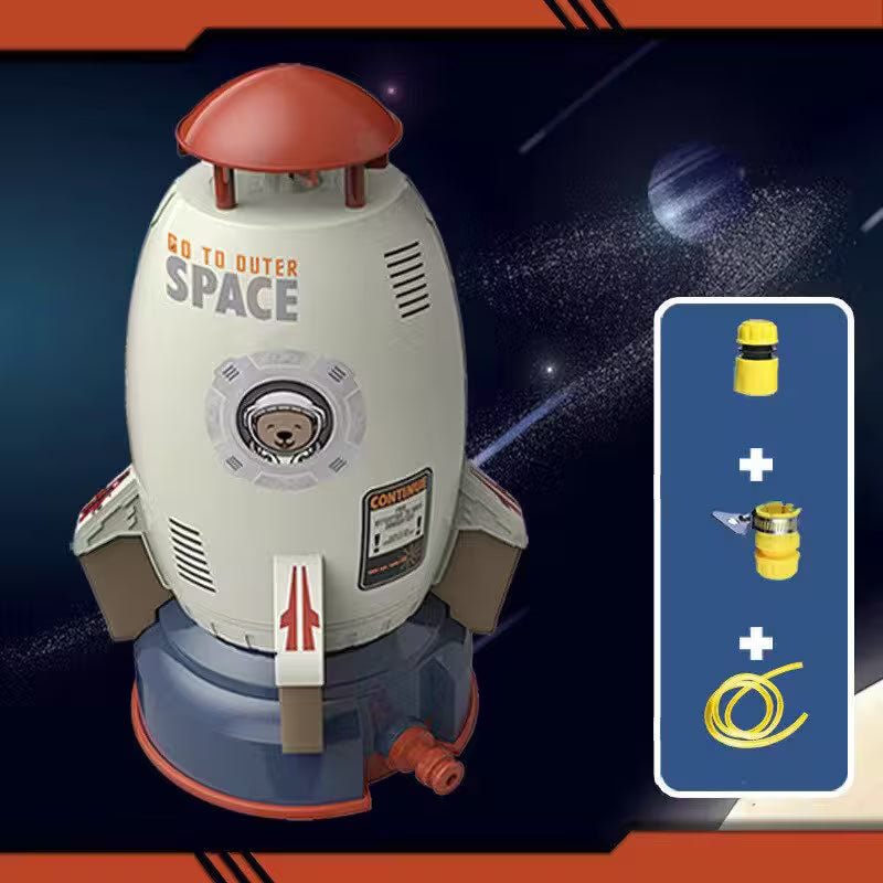 Toy rocket ship with 'Go to Outer Space' text on a space-themed background