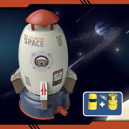 Toy rocket ship with 'Go to Outer Space' text against a space-themed background