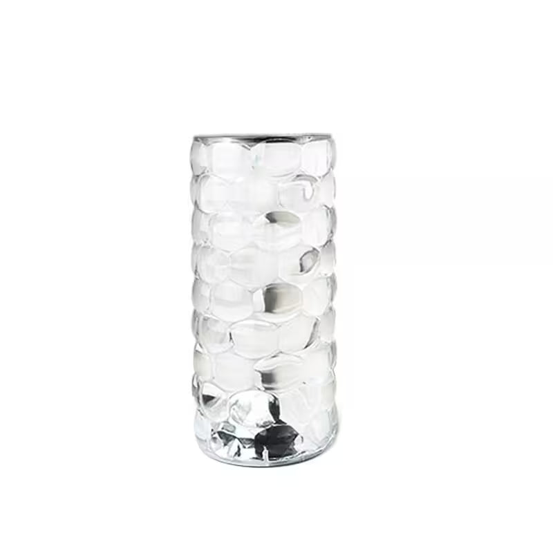 Clear glass vase with textured design on a white background
