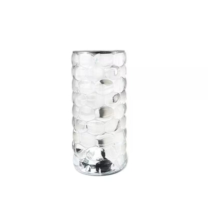 Clear glass vase with textured design on a white background
