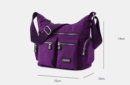Purple shoulder bag with measurement details on a white background